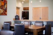 Cecilton apartment for rent - a dining room with a table and chairs and a kitchen with a refrigerator