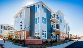 Wood-Ridge apartment for rent - an exterior view of an apartment building with a red fire hydrant