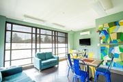 Burlington apartment for rent - a living room with a table and chairs and a large window