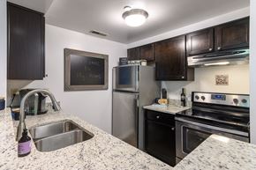 Cincinnati apartment for rent - a kitchen with stainless steel appliances and granite counter tops