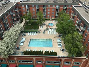 Cincinnati apartment for rent - an aerial view of the courtyard of a hotel with an outdoor pool