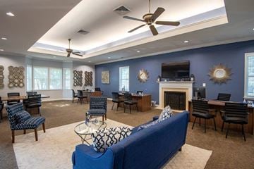 Reisterstown apartment for rent - a living room with a couch and chairs and a fireplace