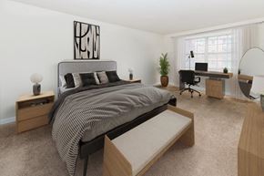 Reisterstown apartment for rent - a bedroom with a bed and a desk
