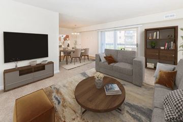 Reisterstown apartment for rent - a living room with a couch a table and a television