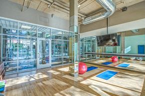 Denver apartment for rent - a bowling alley in a gym with red bowling balls