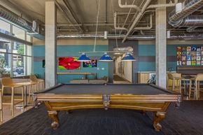 Denver apartment for rent - a game room with a pool table and chairs