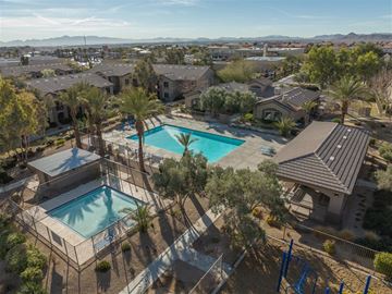 Las Vegas apartment for rent - a aerial view of two swimming pools in a neighborhood with houses and trees