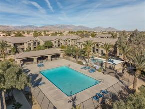 Las Vegas apartment for rent - an aerial view of a swimming pool at the resort with palm trees