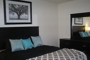 Las Vegas apartment for rent - a bedroom with a bed and a picture of a tree