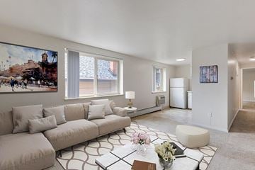 Denver apartment for rent - a living room with a couch and a table