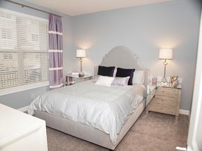 Cincinnati apartment for rent - a bedroom with a large bed and a window