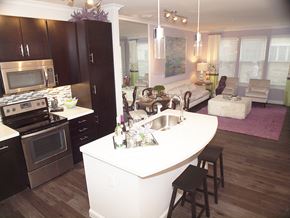 Cincinnati apartment for rent - a view of a kitchen and living room with a white counter top