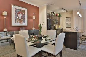 Fairborn apartment for rent - a dining room and kitchen with a table and chairs