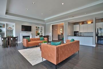 Greenwood apartment for rent - A living room with a brown couch and a television.