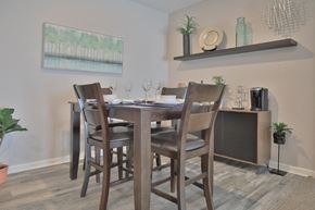 Greenwood apartment for rent - a dining room with a table and chairs and aertainment center