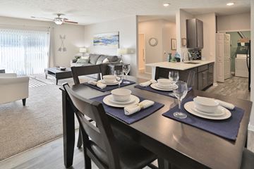Greenwood apartment for rent - an open living room and dining room with a table and chairs
