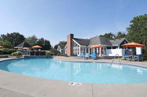 Cincinnati apartment for rent - A swimming pool with a house in the background.