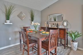 Beavercreek townhouse for rent - a dining room with a wooden table and chairs