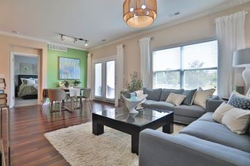 Louisville apartment for rent - A living room with a grey couch and a coffee table.