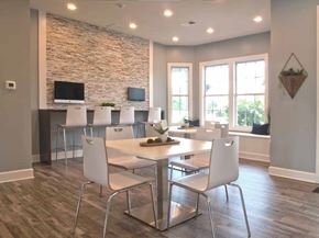 Mason apartment for rent - a dining room with a table and chairs