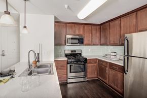 Los Angeles apartment for rent - a kitchen with wooden cabinets and stainless steel appliances