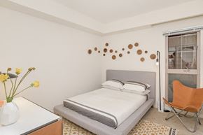 Los Angeles apartment for rent - a bedroom with a bed and a desk and a window
