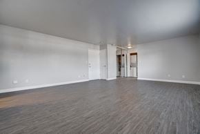 Mountain View apartment for rent - an empty living room with wood floors and white walls