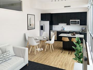 Washington apartment for rent - A modern kitchen with a dining table and chairs.