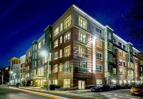 Allston apartment for rent - a large apartment building at night with street lights