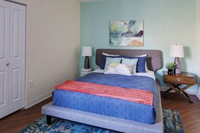 Boston apartment for rent - a bedroom with a bed with a blue comforter