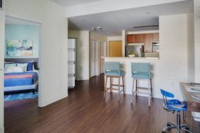 Boston apartment for rent - a view of a living room with a kitchen and a dining room