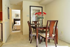 Glen Burnie apartment for rent - a dining room table with chairs and a vase of flowers