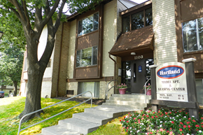 Essex apartment for rent - A building with a sign that says Hartland Model Apt. Leasing Center.
