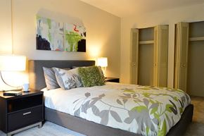 Parkville apartment for rent - Bedroom with cozy bed at Tall Oaks Apartments, Parkville, MD