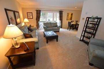Parkville apartment for rent - A living room with a lamp and a couch.