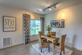 Cottage Grove apartment for rent - a dining room with a table and chairs and a window