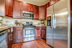 Madison apartment for rent - a kitchen with stainless steel appliances and wooden cabinets