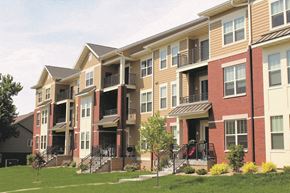 Madison apartment for rent - a row of apartment buildings with stairs and grass
