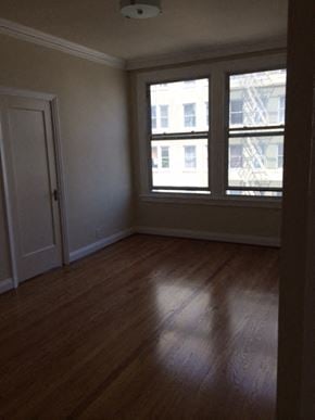 San Francisco apartment for rent - a living room with a wood floor and two windows