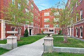 Oak Park apartment for rent - A red brick building with a walkway in front.