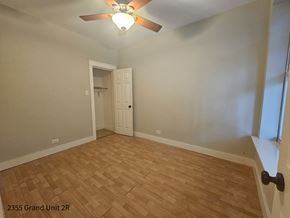 Chicago apartment for rent - the living room with hardwood flooring and a ceiling fan