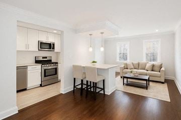 Upper Montclair townhouse for rent - A modern kitchen with a dining table and chairs.