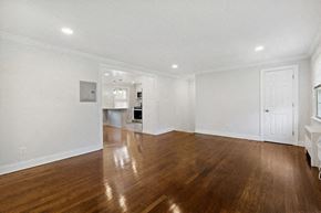 Springfield apartment for rent - a living room with a hard wood floor and white walls