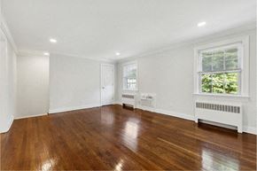 Springfield apartment for rent - a living room with wood floors and white walls and a window
