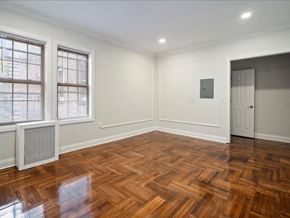 Jersey City apartment for rent - a living room with a hard wood floor and a door