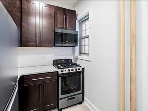 Jersey City apartment for rent - a kitchen with a stove and a microwave
