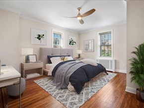 Summit apartment for rent - a bedroom with a bed and a ceiling fan