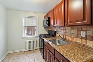 Bloomfield apartment for rent - a kitchen with granite counter tops and a sink