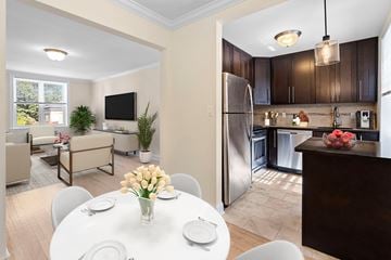 Upper Montclair apartment for rent - a kitchen and dining room with a white table and chairs