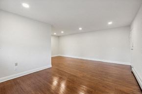 Clark apartment for rent - a living room with white walls and wood floors